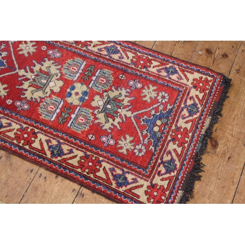 397 - A Rust & Beige bordered Blue Central Medallioned Geometric Weaved Runner. Measuring: 200cms long x 6... 