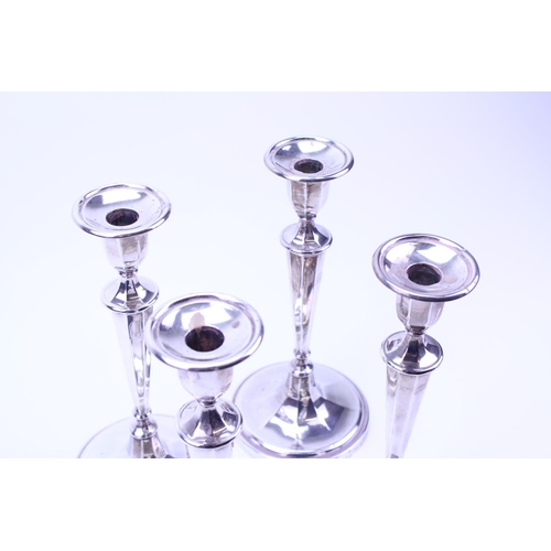 86 - A Set of Four 1910 Goldsmiths and Silversmiths Company, Adams Design Silver Candlesticks with Silver... 