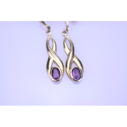 166 - A Pair of 9ct Gold Long Drop Amethyst Earrings. Weighing: 2.5 grams.