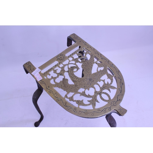 514 - An Antique Wrought iron and brass topped Kettle Trivet.