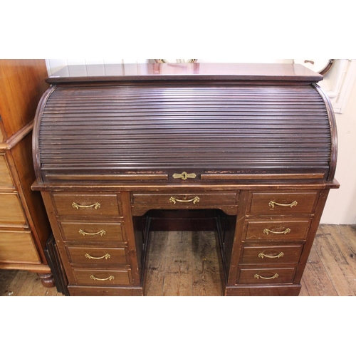 591 - A 1920s Tambour Fronted Office Desk with fitted interior on pedestal sides & brass handles. Measurin... 