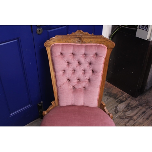 595 - A Victorian Walnut Framed Easy Chair upholstered in Pink Dralon & Turned Front Legs.