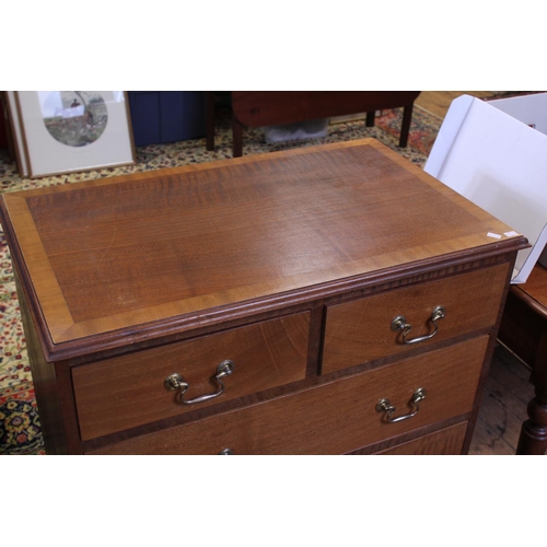 596 - A Mahogany & Cross Banded Chest of Two Short & Three Long Drawers with Brass Handles. Measuring: 76c... 