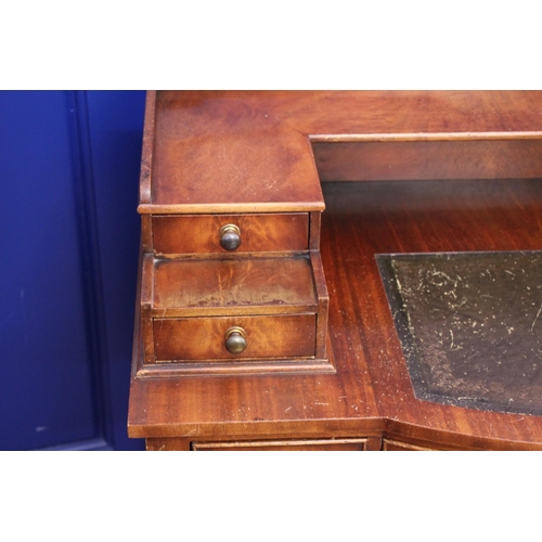 611 - A Reproduction Regency Designed Carlton House Desk fitted with Drawers resting on square Spade Legs.... 