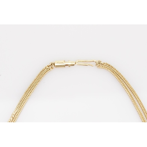 199 - A Ladies 9ct Gold Milanese Strap Knot Necklace. Total weight: approx 32 grams.