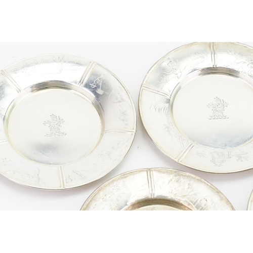 36 - A Set 1825, Four American Silver Pin Dishes with engraved scenes. Heraldic Crest. Total weight: appr... 