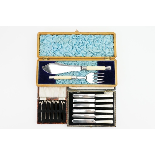 77 - A set of mother of pearl handled cake knives along with fish servers, etc.