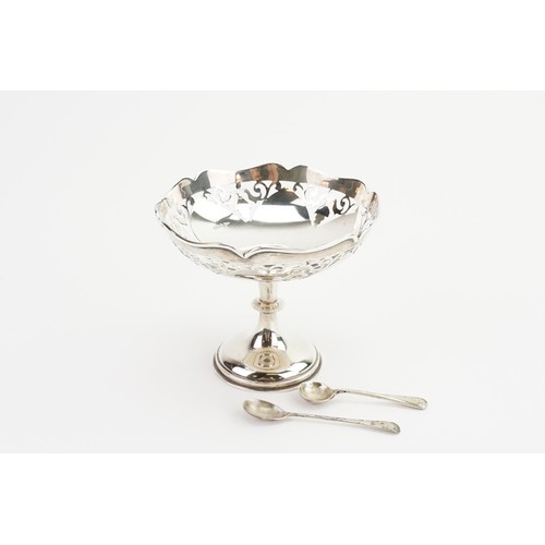 37 - A Silver Pierced Bon Bon Dish resting on a Pedestal Base along with two Silver Salt Spoons. Weighing... 