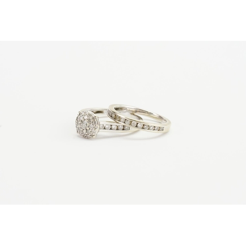 262B - An unmarked ladies diamond wedding band set. 0.72 largest diamond, surrounded by smaller diamonds. S... 