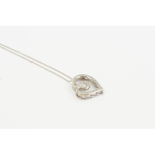 262C - A 9ct white gold love heart pendant on chain, set with diamonds. Total weight approx 2.3g.