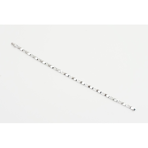 262I - A 9ct white gold link bracelet, set with diamonds. Weight approx 8.8g. Length approx 19.8cm.