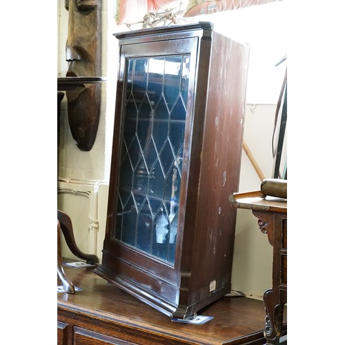 559 - An designed Corner Cabinet fitted with a Leaded Glass Single Door. Measuring: 48cms deep x 66cms wid... 