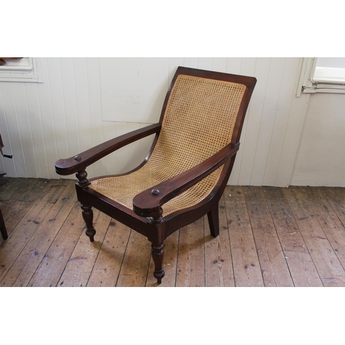 343 - A Large Lombok Rattan Planters Chair in Mahogany with shaped back & turned front legs.