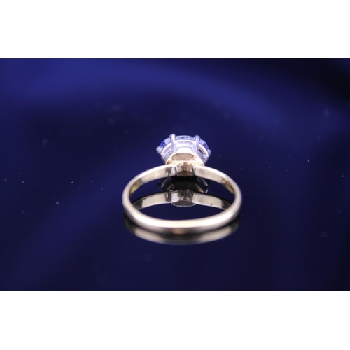 55 - A Ladies 18ct Gold Ring mounted with a single Sapphire. Size: M. Weighing: 2.6 grams.