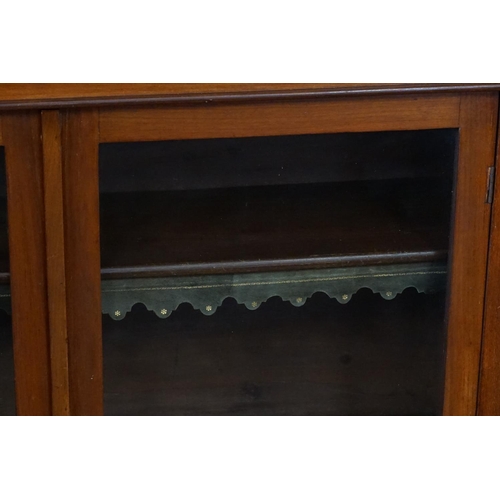 390 - A Victorian Mahogany Double Door & Shelf Walnut Bookcase with a Leather Book Fronts. Measuring: 107c... 