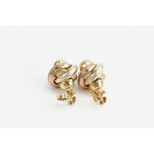 77 - A Pair of 9ct Three Gold Knot Design Earrings. Total weight approx 5.5 grams.