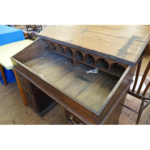 393 - A Victorian Lift-Up Top Rent Desk resting on a Four Drawers Twin Pedestal Base. Measuring: 123cms ac... 