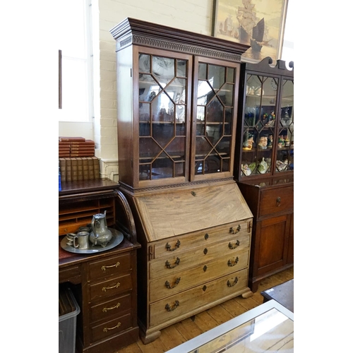 394 - A Georgian Mahogany Bureau fitted with Four Graduated Drawers, Brush & Slides, Swept Bow Feet, Brass... 