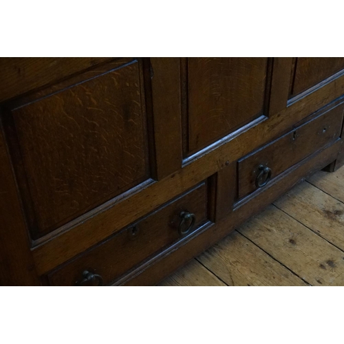 395 - A Georgian Oak Three Panelled Mule Chest fitted with two Drawers. Measuring: 122cms across x 52cms d... 