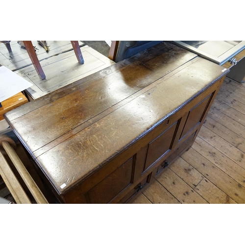 395 - A Georgian Oak Three Panelled Mule Chest fitted with two Drawers. Measuring: 122cms across x 52cms d... 