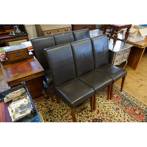 400 - A Set of Six Brown Covered Dining Room Chairs resting on Square Legs & Roll Over Backs.