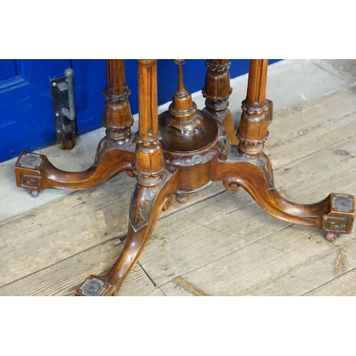 409 - A Victorian Demi-Lune Walnut veneered Fold Over Top Card Table resting on quadruple turned supports ... 