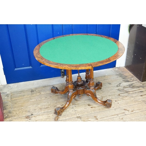 409 - A Victorian Demi-Lune Walnut veneered Fold Over Top Card Table resting on quadruple turned supports ... 