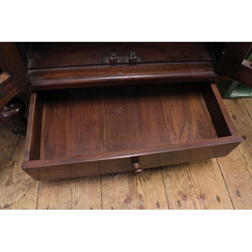 488 - An Indian hardwood splat door cabinet fitted with double doors & resting on a square base. Measuring... 