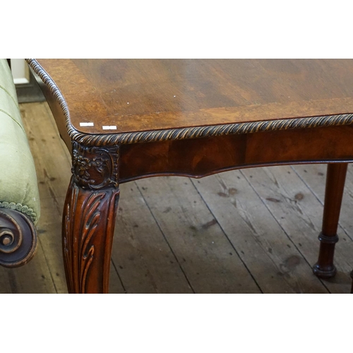 528 - A Georgian Design Cuban Mahogany Veneered Drawer Leaf Table with elongated Spanish Foot resting on S... 