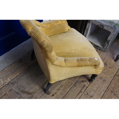 532 - A Victorian Easy Chair of Low Down Form, scroll over button back arms & covered in velour.