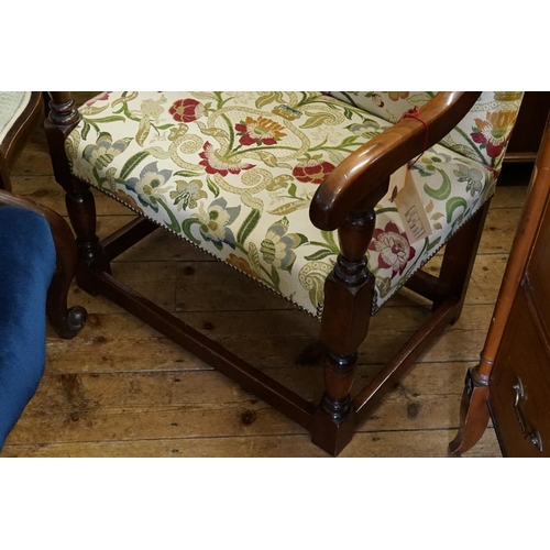 539 - A Walnut Framed Cromwellian Style Delegation Arm Chair with a Tapestry workback & seat on turned sup... 