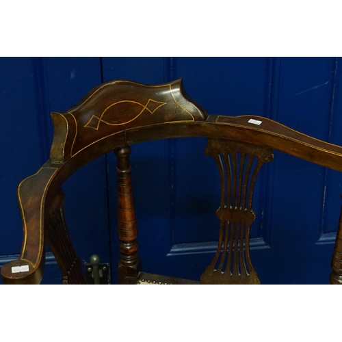 586 - An Edwardian stained as Mahogany & Holly inlaid Elbow Chair resting on turned legs & Cross Stretcher... 