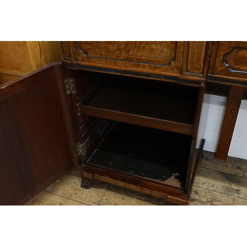 588 - A Large Scottish Sunk Section Sideboard with Cuban Mahogany Veneered Doors & resting on carved feet.... 