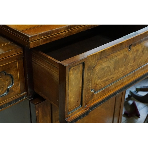 588 - A Large Scottish Sunk Section Sideboard with Cuban Mahogany Veneered Doors & resting on carved feet.... 