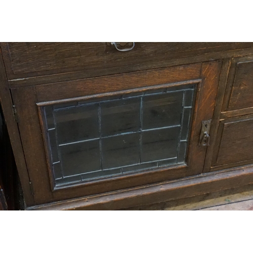 597 - An Art Nouveau Bureau fitted with a Leaded Glazed Door, one long drawer above two short drawers & re... 