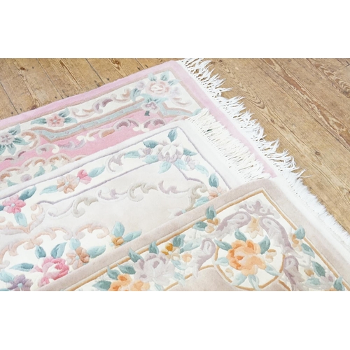 264 - Three Beige & Pink Floral Cut & Shaped Chinese Rugs with Fringe Ends.