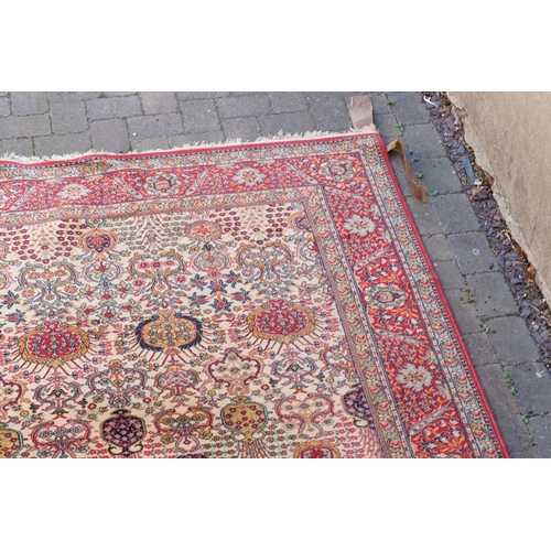 271 - A large Persian Design All Over & Red Bordered Carpet with a fringed edge. Measuring: 390cms long x ... 