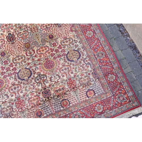 271 - A large Persian Design All Over & Red Bordered Carpet with a fringed edge. Measuring: 390cms long x ... 