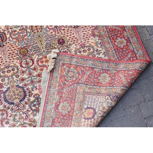 271 - A large Persian Design All Over & Red Bordered Carpet with a fringed edge. Measuring: 390cms long x ... 