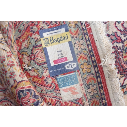 271 - A large Persian Design All Over & Red Bordered Carpet with a fringed edge. Measuring: 390cms long x ... 