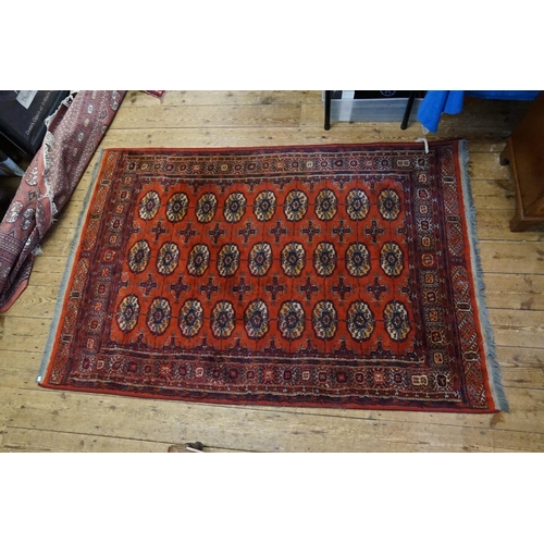 273 - A Red Ground Gull & Cross patterned Central Medallioned Bordered Rug. Measuring: 230cms x 130cms.