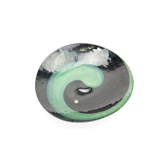 308 - A modern Murano green and black glass bowl with a fixed paper sticker. Measuring: 46cms Diameter.