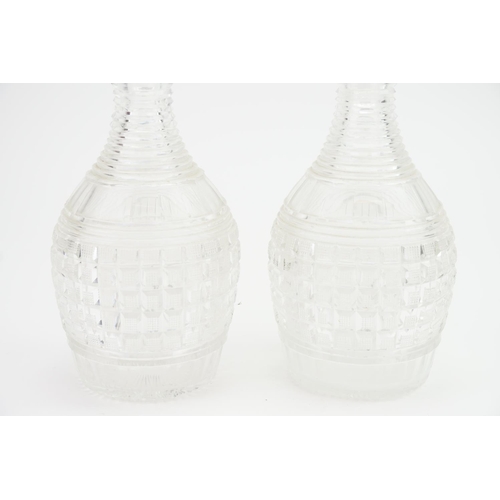 322 - A Pair of Regency cut glass hob nail cut decanters with later stoppers.