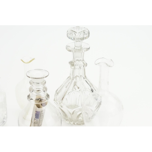 337 - A Heavy cut glass decanter and stopper along with four other various decanters.