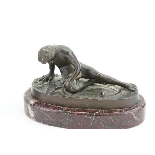 423 - A Bronzed Study of the Discus Thrower & one other of the wounded Gladiator on a marble base.