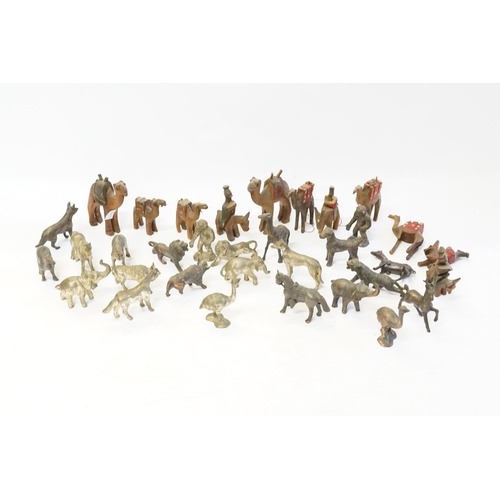 407 - A collection of bronzed animals and antimony  and a collection of Egyptian carved wood camels.