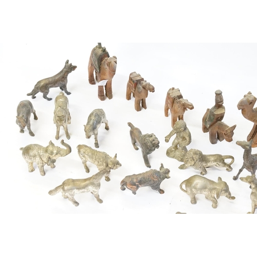 407 - A collection of bronzed animals and antimony  and a collection of Egyptian carved wood camels.