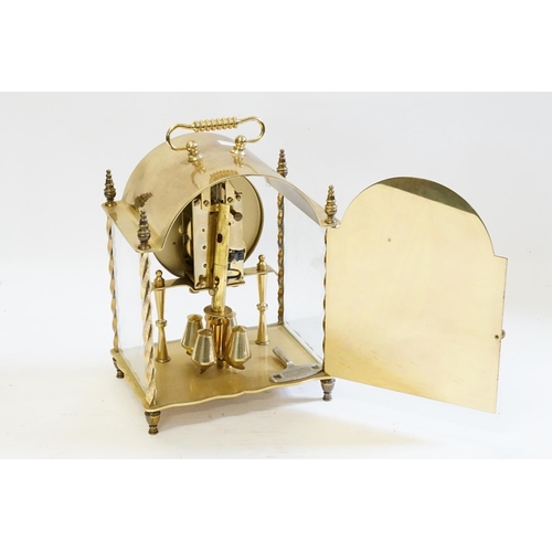 613 - KOMA brass cased dome topped mantle clock, with oscillated pendulum.