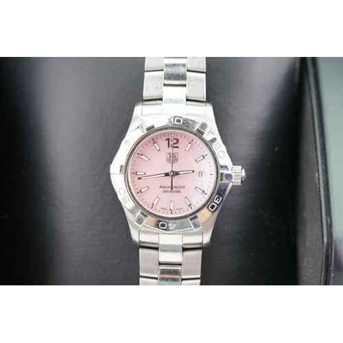 224 - A ladies stainless steel Tag Huer, pink mother of pearl dial in original box, along with papers and ... 