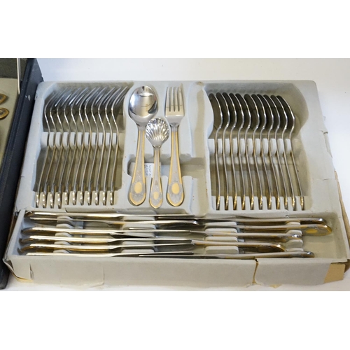 44 - A case containing a collection of gilt steel cutlery.